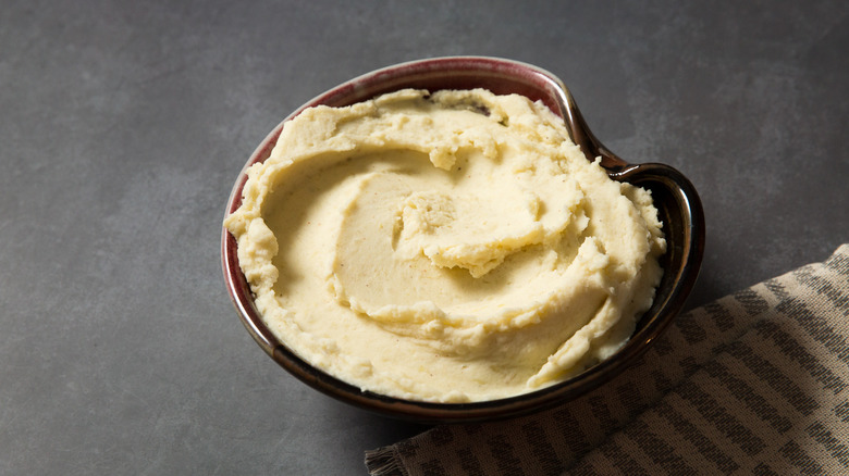 Mashed potatoes served on gray table