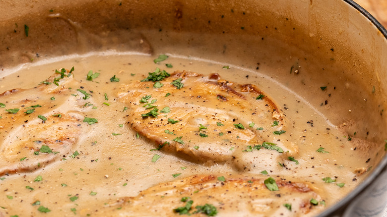 Pork chops smothered in sauce