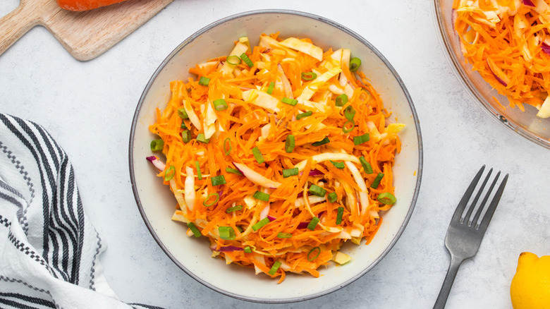Bowl of carrot slaw with green onions