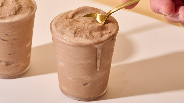 dipping a spoon into a frosty