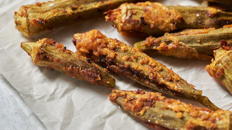 Crispy roasted okra on white parchment paper