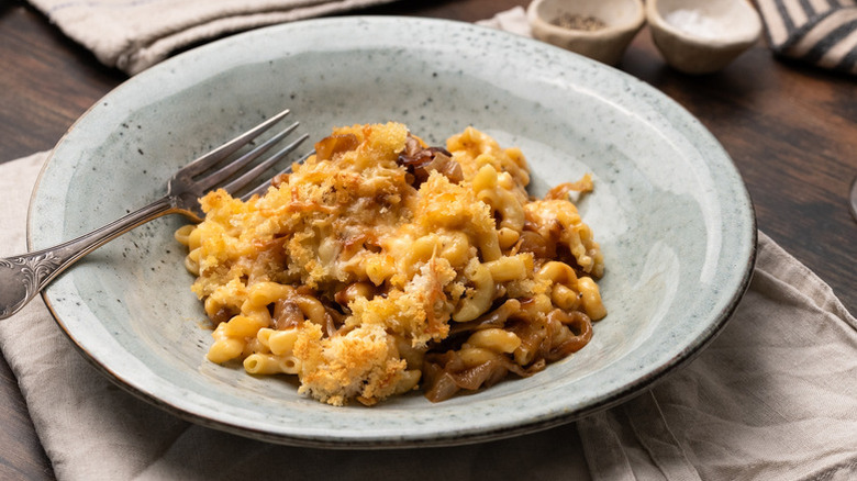 Bowl of French onion mac and cheese with fork
