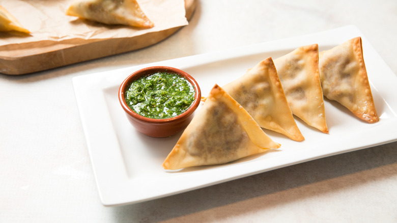 baked samosas served on table
