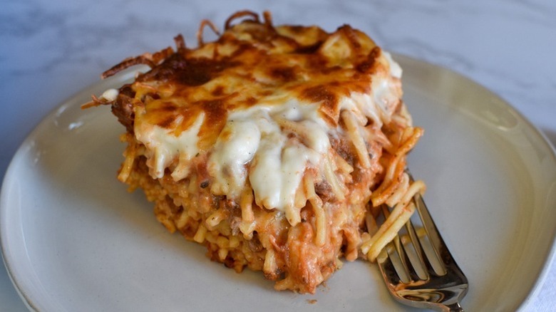 Portion of cheesy spaghetti bake on plate