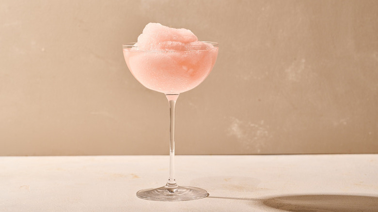 Pale pink frozen cocktail in rounded coupe glass
