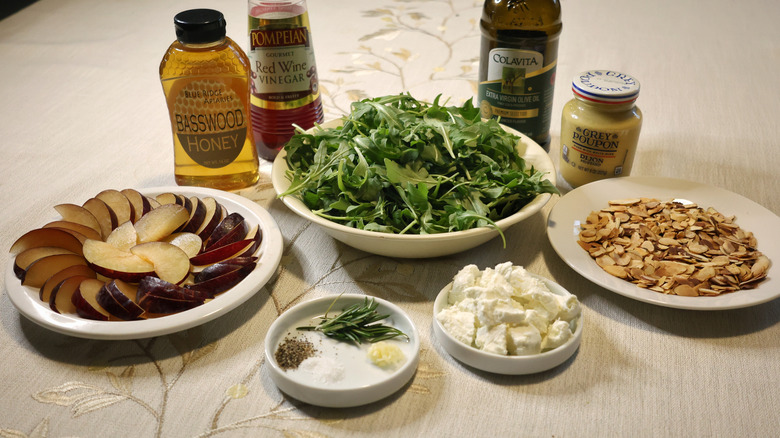 arugula salad ingredients set out on a table