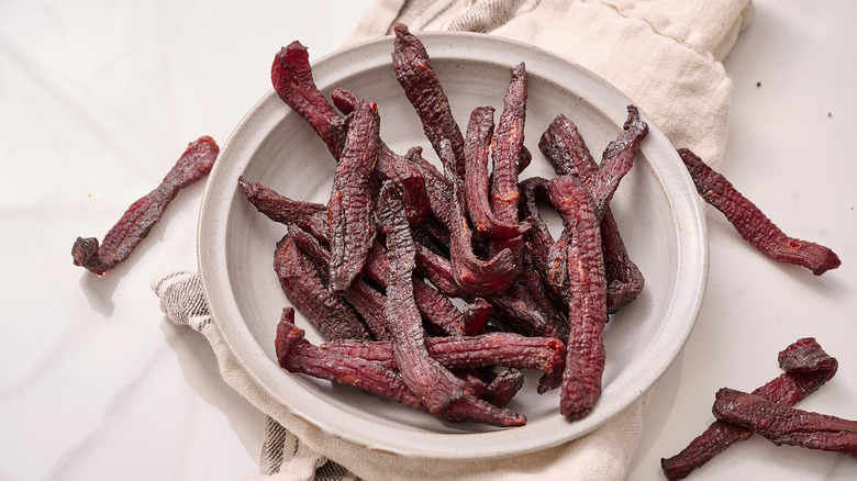 beef jerky piled in a bowl