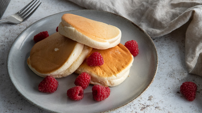 pancakes with raspberries on plate