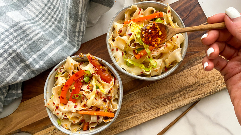 adding chile oil to noodles