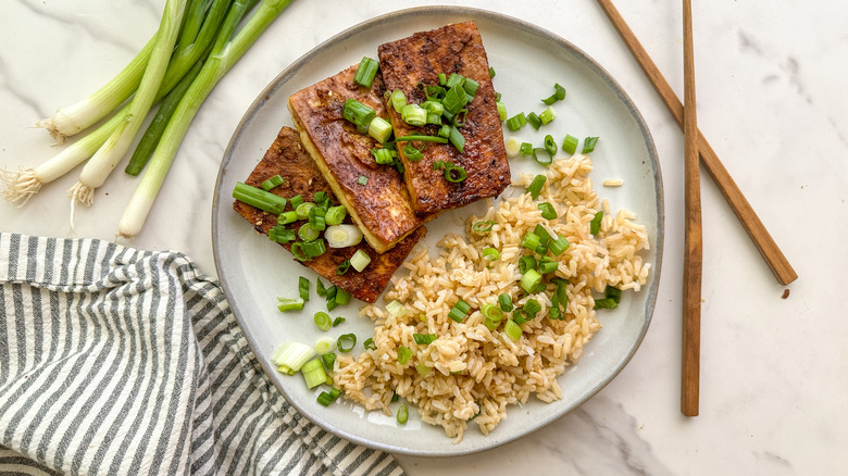 dubu jorim on plate with brown rice