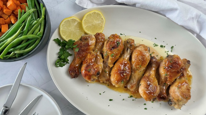 chicken legs on white plate