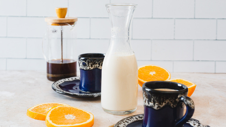 two cups of coffee and creamer