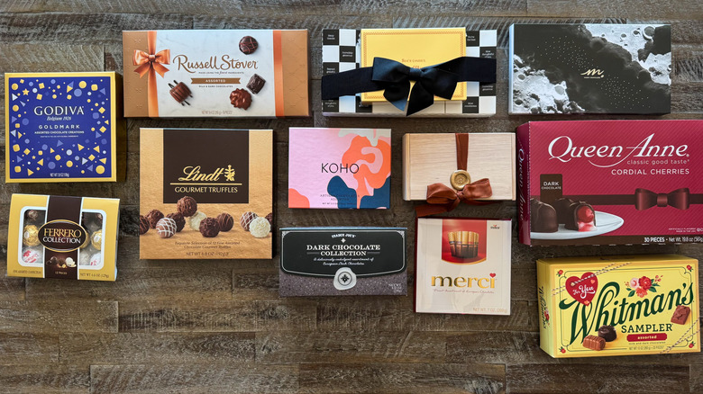 Boxes of chocolate on wooden background