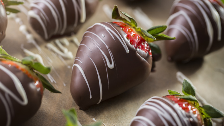 Chocolate covered strawberries on a sheet