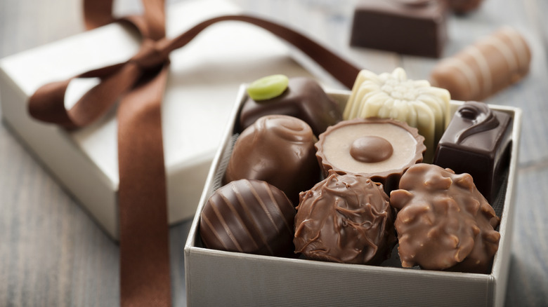 assorted boxed chocolates with satin ribbon