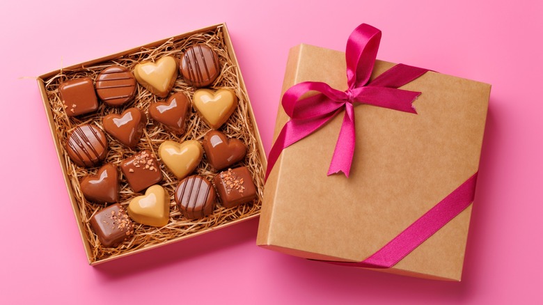 Overview of a Valentine's Day box of chocolates with a pink background