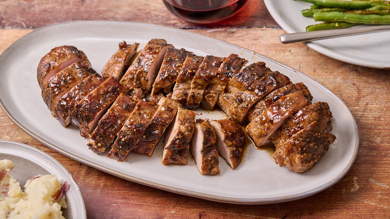 sliced pork tenderloin on platter