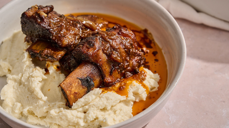 short ribs in a bowl with mashed potatoes