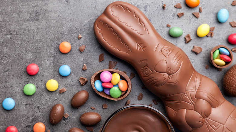 Chocolate Easter bunny and eggs with colorful candies