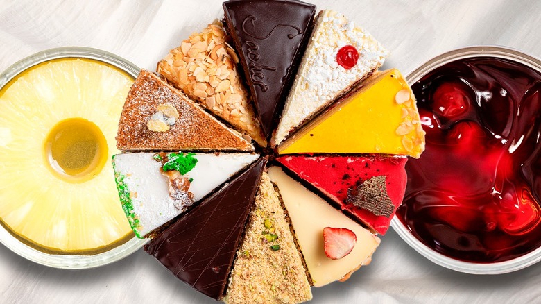 Several slices of cake surrounded by canned pineapple and cherries