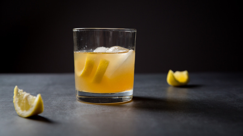 golden cocktail on gray background