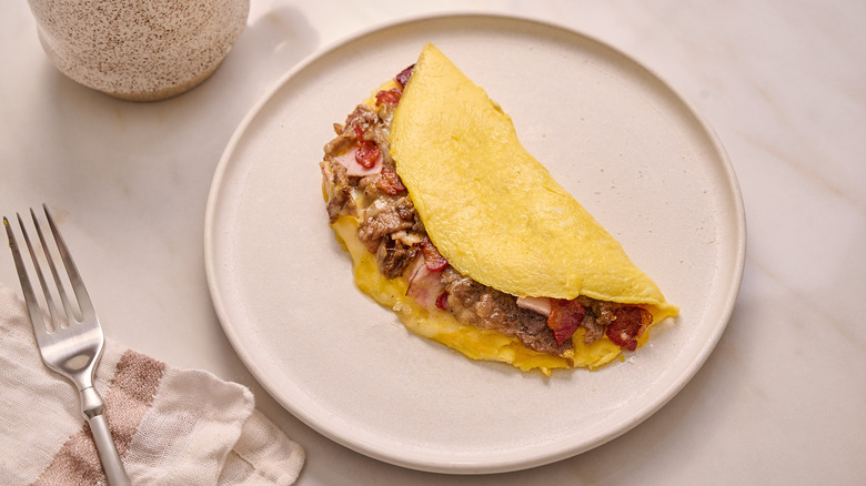 meat lover's omelette on a plate