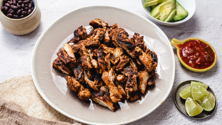 Chipotle honey chicken on plate with toppings