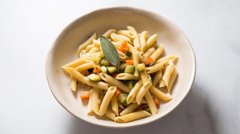 pasta risottata in beige bowl