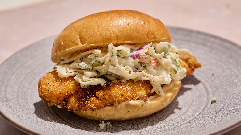 Catfish sandwich with slaw on a plate