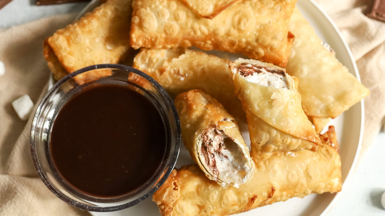 egg rolls with bowl of chocolate sauce