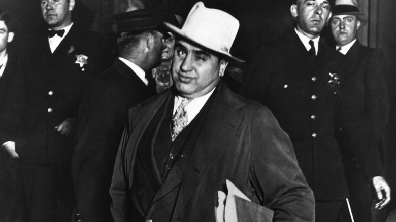 A black and white photo of Al Capone winking