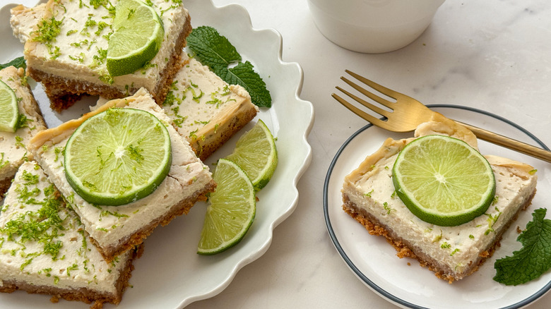 Key lime bars on serving platter with one bar on small plate