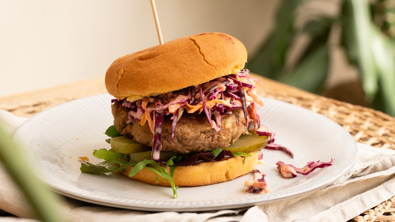 beef and white bean burger on a white plate