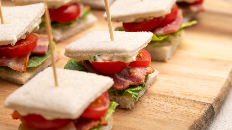 mini BLT sandwiches on serving board