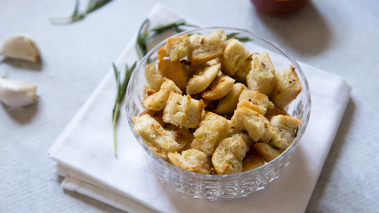 crispy croutons in clear dish