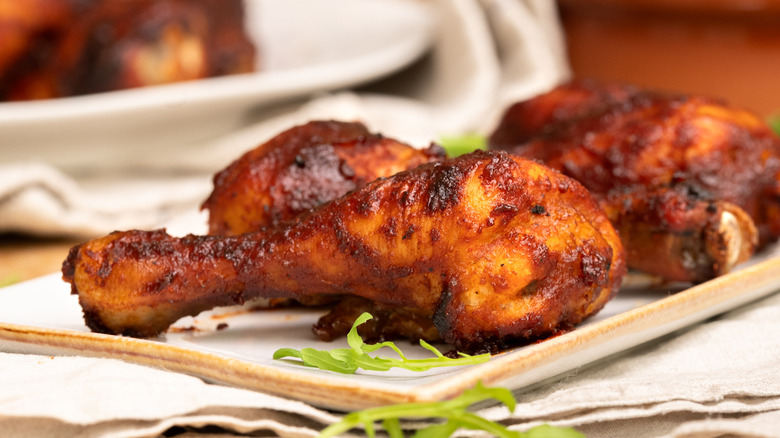 Close up of Dr Pepper barbecue chicken arranged on a dish