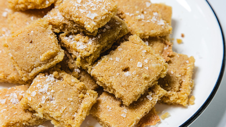 Crackers with flaky sea salt on plate