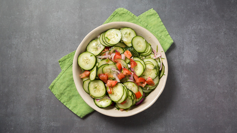 cucumber salad served on table