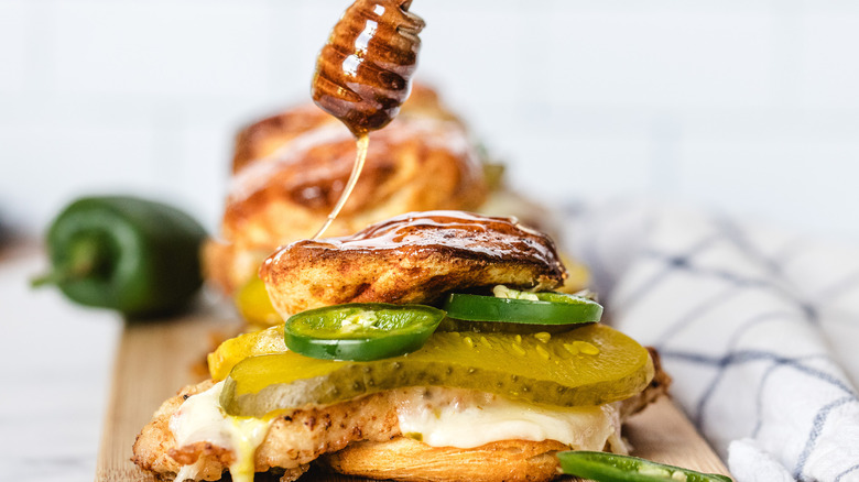 Drizzling honey on sandwiches