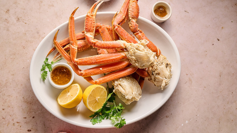 steamed crab legs on a platter