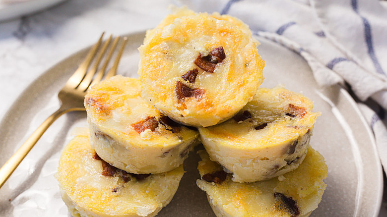 Pile of bacon egg bites on plate