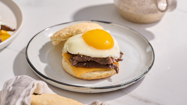 steak and biscuit sandwich on a plate