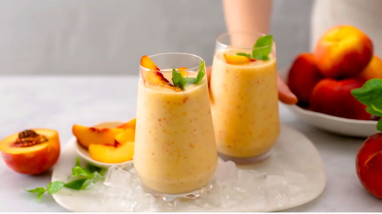 two glasses of fruit smoothie with garnishes