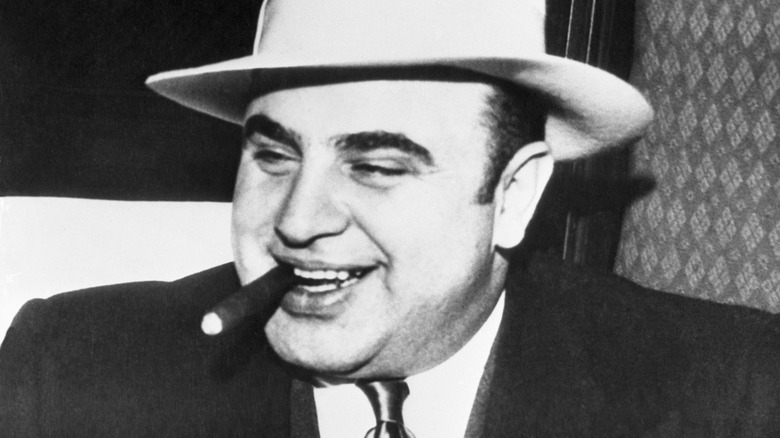 Al Capone smiling with cigar