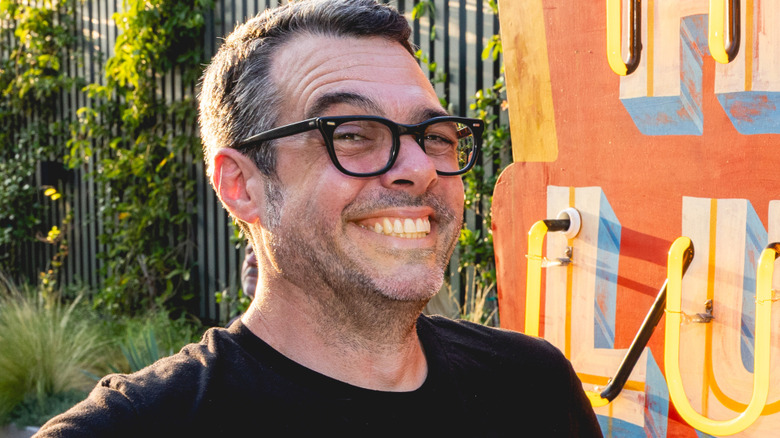 Aaron Franklin in front of sign