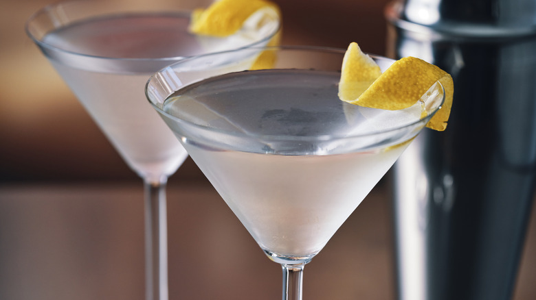 martini cocktails with lemon peel garnish