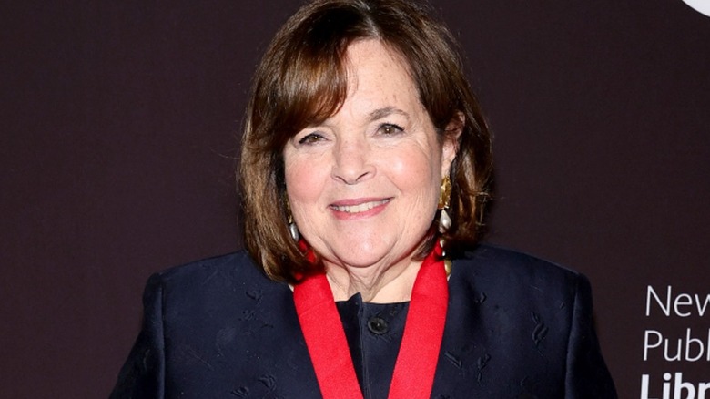 Ina Garten against maroon background