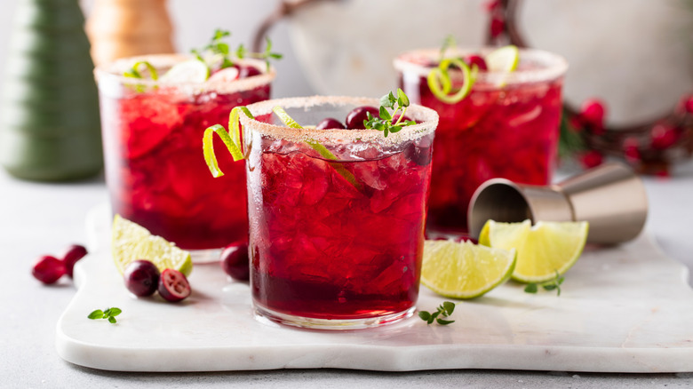 Cranberry cocktail next to cranberries