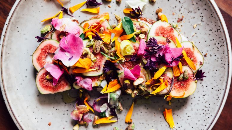 Edible flowers on a salad palate