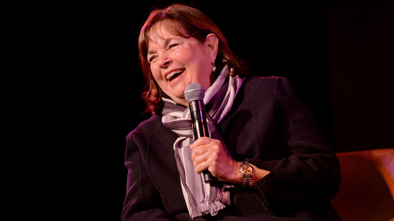 Ina Garten laughing and smiling during formal presentation